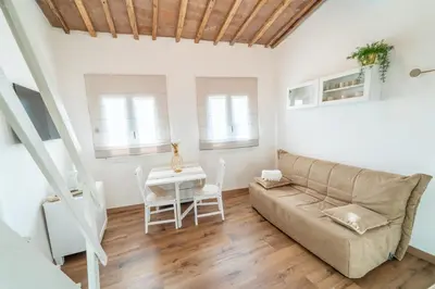 Area soggiorno di Nido romantico e accogliente nel cuore di Firenze