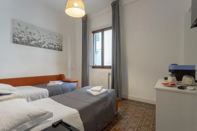 Letto o letti in una camera di Delux Via Faenza