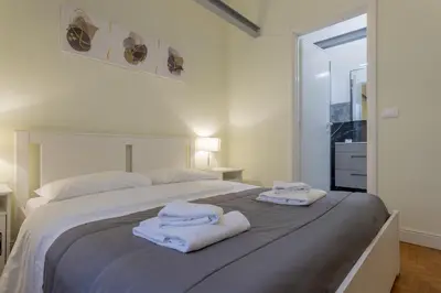 Letto o letti in una camera di Delux Via Faenza