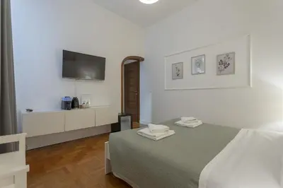 Letto o letti in una camera di Delux Via Faenza