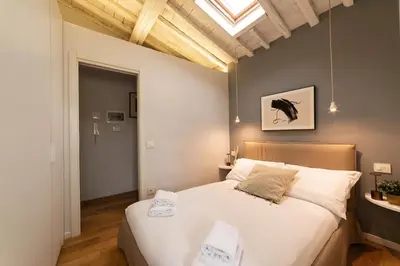 Letto o letti in una camera di LOFT 12 Apt in City center