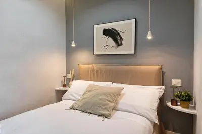 Letto o letti in una camera di LOFT 12 Apt in City center