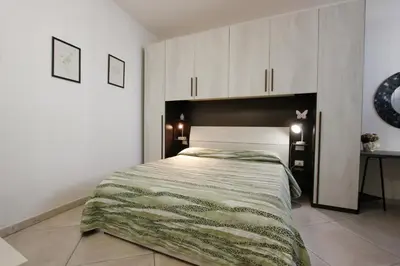 Letto o letti in una camera di Suite dei Vanni con parcheggio privato gratuito