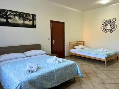 Letto o letti in una camera di Viol'House - Campi Bisenzio - Florence