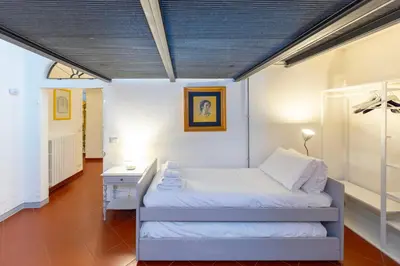 Letto o letti in una camera di Charming Historic Apartment with Modern Comfort in the Heart of Florence