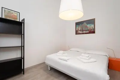 Letto o letti in una camera di Ognissanti Central Apartment