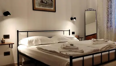 Letto o letti in una camera di Dimora Luciano Peaceful Home Stay Surrounded by a Beautiful Garden