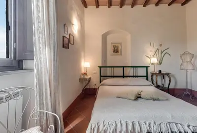 Letto o letti in una camera di B&B Le Torri Di Firenze