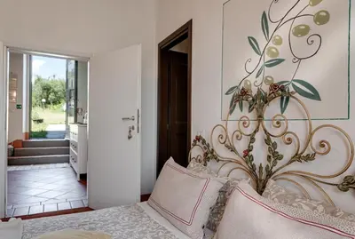 Letto o letti in una camera di B&B Le Torri Di Firenze