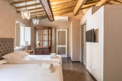 Letto o letti in una camera di Firenze Rentals Accademia