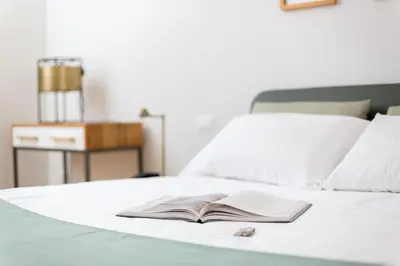 Letto o letti in una camera di Relais Luce Florence