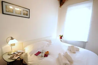 Letto o letti in una camera di Acacia Apartments Salvia-Rosmarino