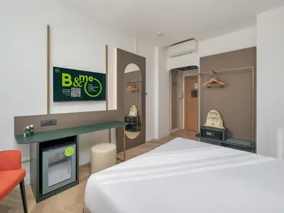 Letto o letti in una camera di B&B HOTEL Calenzano First