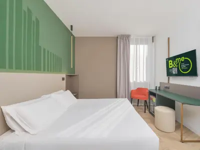 Letto o letti in una camera di B&B HOTEL Calenzano First