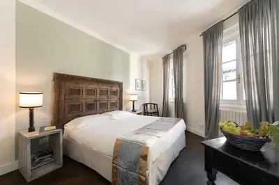 Letto o letti in una camera di Novella Goldoni Suite-by Florence Concierge