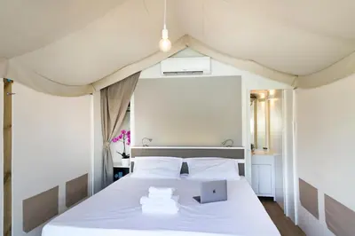 Letto o letti in una camera di hu Firenze Camping in Town