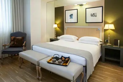 Letto o letti in una camera di Starhotels Tuscany