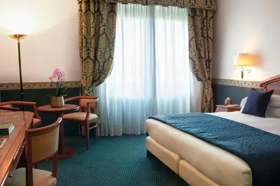Letto o letti in una camera di Starhotels Vespucci