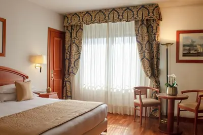 Letto o letti in una camera di Starhotels Vespucci