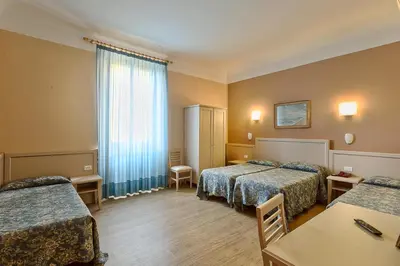 Letto o letti in una camera di Hotel Eden
