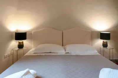 Letto o letti in una camera di Rondinelli Charme Prestige