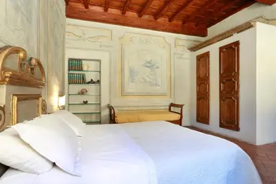 Letto o letti in una camera di Residenza di charme pressi piazza Pitti