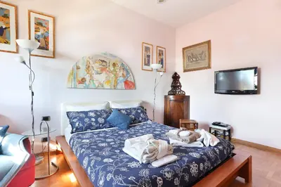 Letto o letti in una camera di La tua Casa a Firenze con parcheggio privato per 2 auto