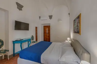 Letto o letti in una camera di Residenza d'Epoca Galleria dell'Accademia