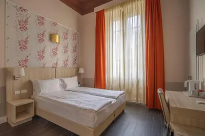 Letto o letti in una camera di B&B Repubblica