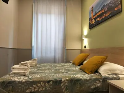 Letto o letti in una camera di Hotel Camilla Guelfa