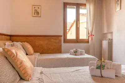 Letto o letti in una camera di Piccolo Iris Firenze