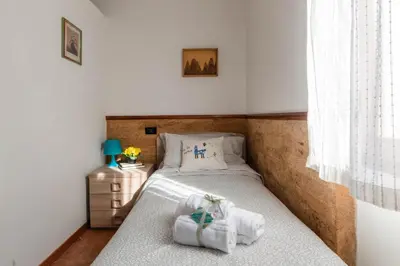 Letto o letti in una camera di Piccolo Iris Firenze