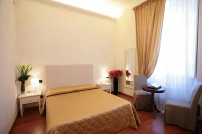 Letto o letti in una camera di B&B Magnifico Messere