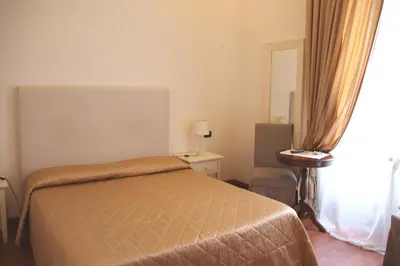 Letto o letti in una camera di B&B Magnifico Messere