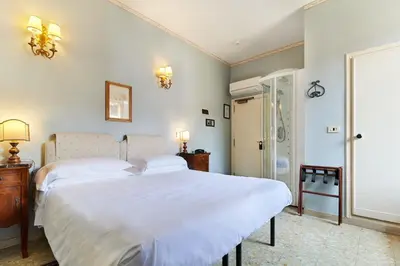 Letto o letti in una camera di Hotel Hermitage