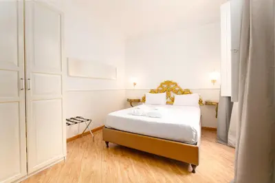 Letto o letti in una camera di Residenza Conte di Cavour & Rooftop - dBe Hotels