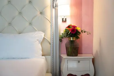 Letto o letti in una camera di Residenza Conte di Cavour & Rooftop - dBe Hotels
