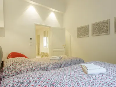 Letto o letti in una camera di San Firenze Luxury Apartment by Mamo Florence