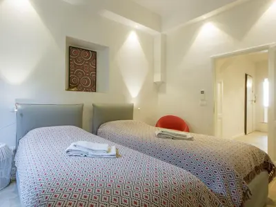 Letto o letti in una camera di San Firenze Luxury Apartment by Mamo Florence
