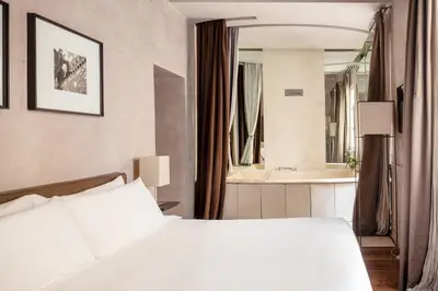 Letto o letti in una camera di Ricasoli Firenze Luxury Apartments | UNA Esperienze