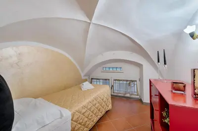 Letto o letti in una camera di Santo Spirito Frescos by Mmega