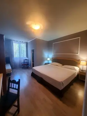 Letto o letti in una camera di Hotel Fedora
