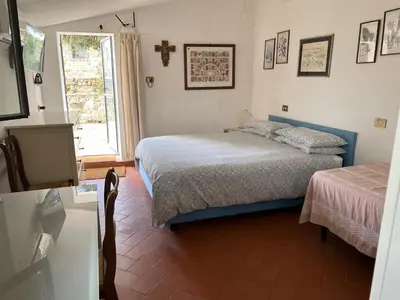 Letto o letti in una camera di Villetta Gabriella