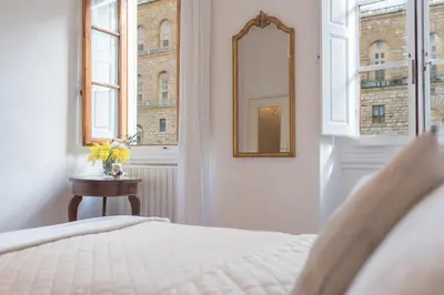 Letto o letti in una camera di Pitti - Flo Apartments charme su Piazza Pitti