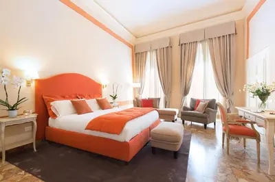 Letto o letti in una camera di B&B Cerretani Palace