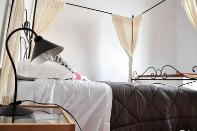 Letto o letti in una camera di Leopoldini Appartamenti