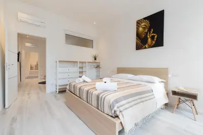 Letto o letti in una camera di Keys of Italy - Masai - Albero 2 - One bedroom flat 1st floor by train station
