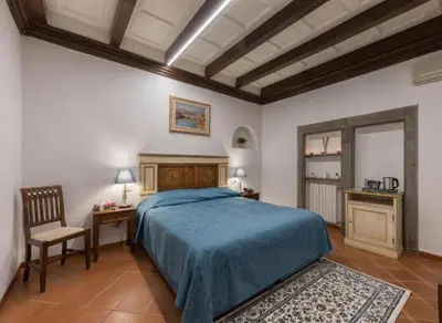 Letto o letti in una camera di Numa Florence Palazzo Haggis