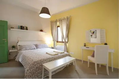 Letto o letti in una camera di La casetta dipinta 2.0