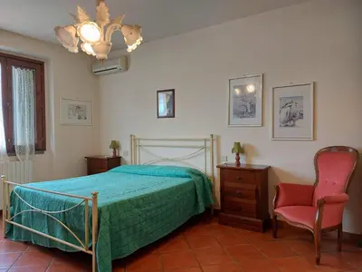 Letto o letti in una camera di Casa Vacanze - La Ginestra